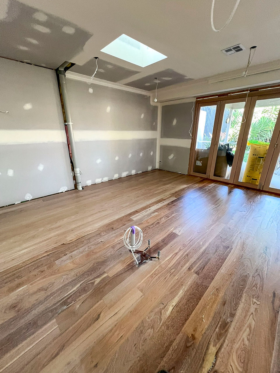 Completed Jarrah timber flooring with subtle lime wash and Rubio finish for a unified look.