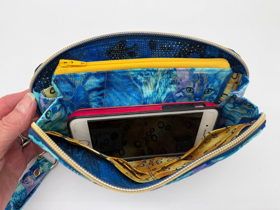 Thumbnail: Inside view with cell phone and ample room for more items.