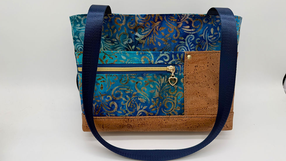 Front of blue and brown small tote. Constructed with cork and cotton batik is serves well as a shoulder bag/tote