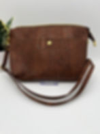 Front showing gold snap pocket and strap