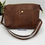 Thumbnail: Front showing gold snap pocket and strap