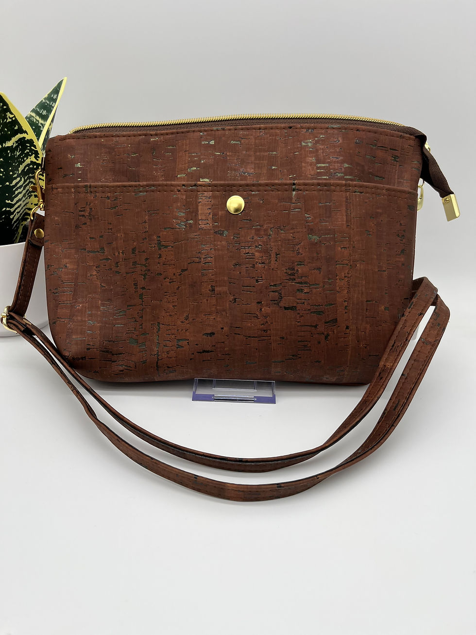 Front showing gold snap pocket and strap