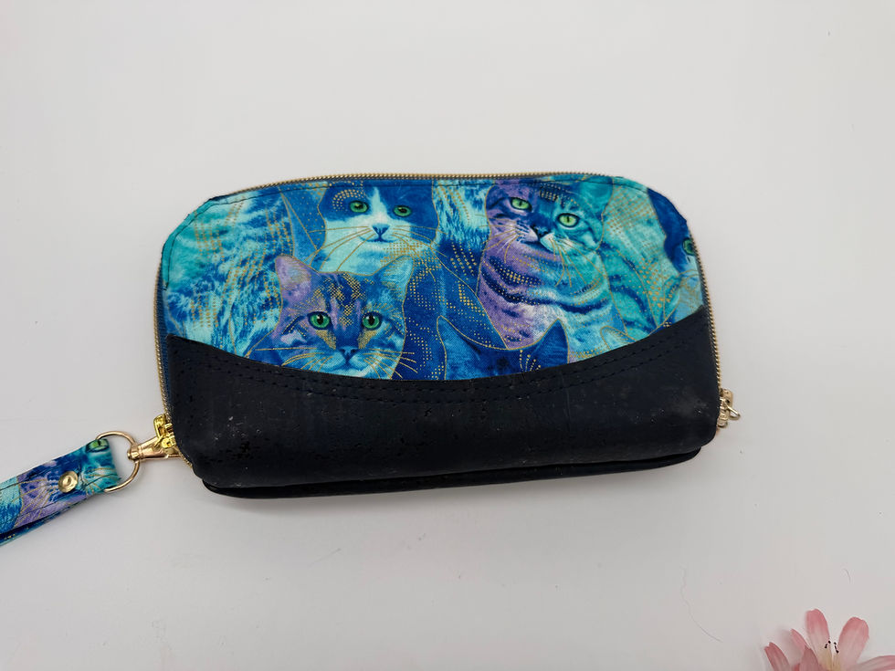 Reverse side showing a different collage of cats on cotton trimmed in nay blue cork.