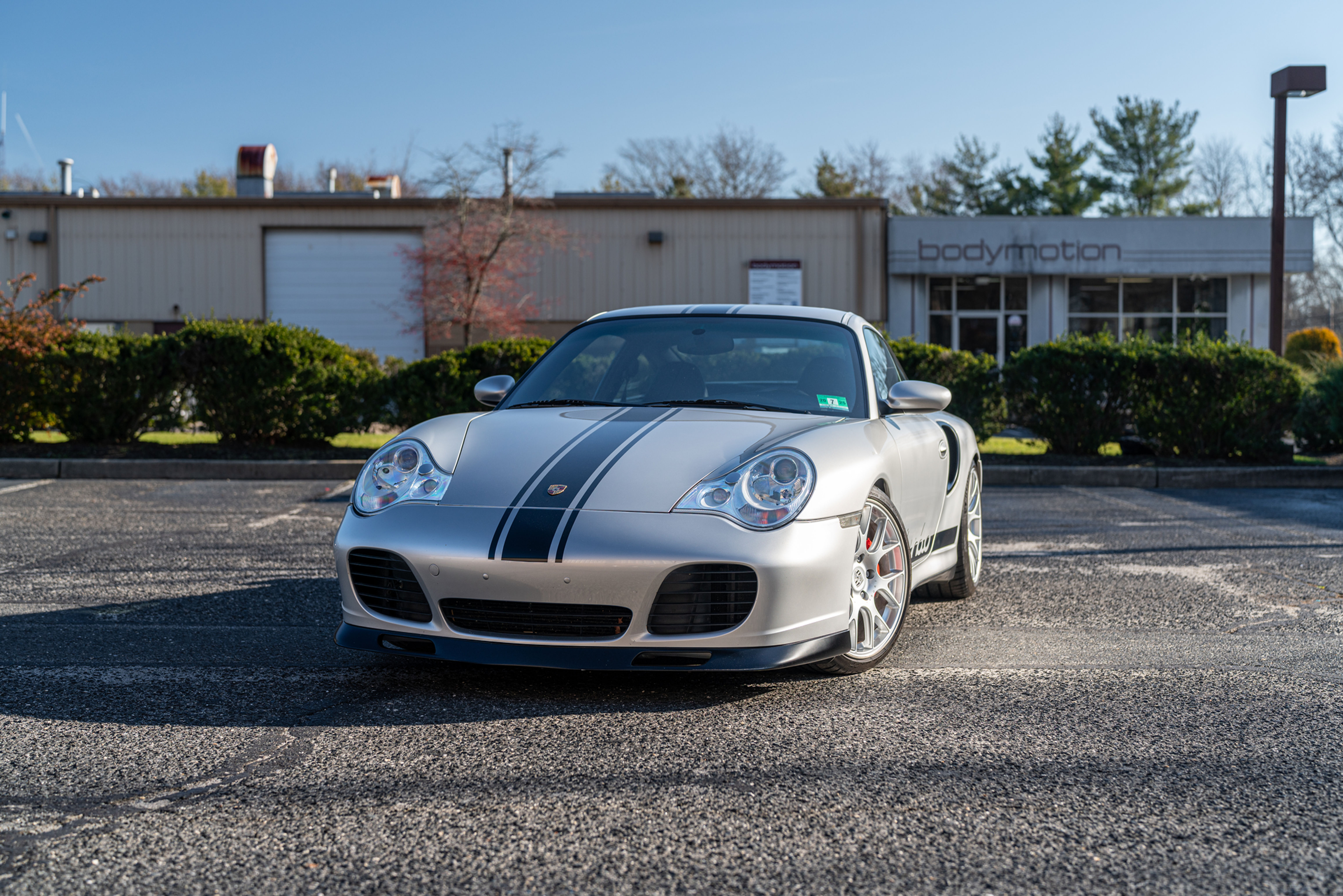 silver 2003 Porsche Turbo X50 6 Speed with black stripe in the middle