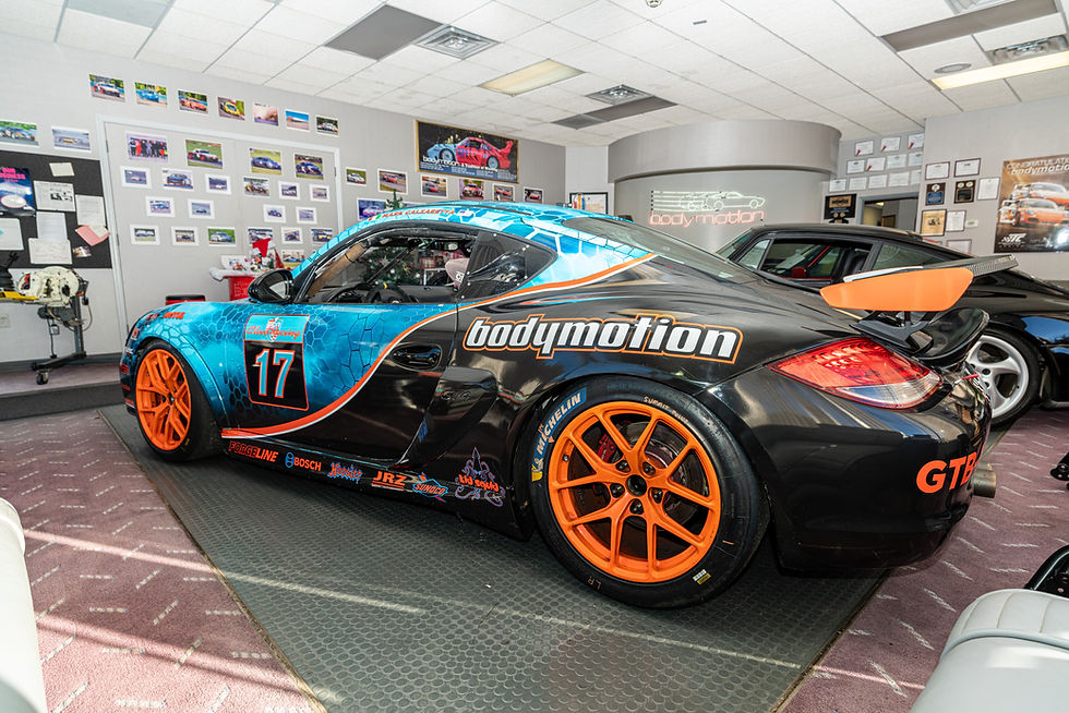 Thumbnail: side view of blue 2012 Cayman S Race Car
