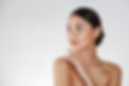 beauty-portrait-feminine-young-woman-looking-away-touching-her-nude-shoulder-isolated-whit