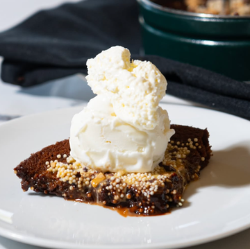 Warm chocolate brownie topped with a scoop of vanilla ice cream