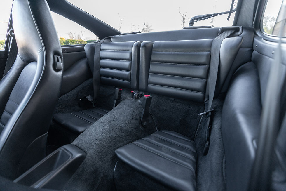 Thumbnail: Back seats of red 1989 Porsche 911 Carrera 4 Coupe 5 Speed