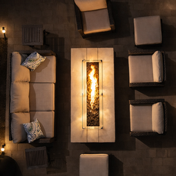 Overhead view outdoor patio furniture set with lit rectangular fire pit. | Down To Earth Landscaping | Jackson New Jersey, USA (732) 833-7702