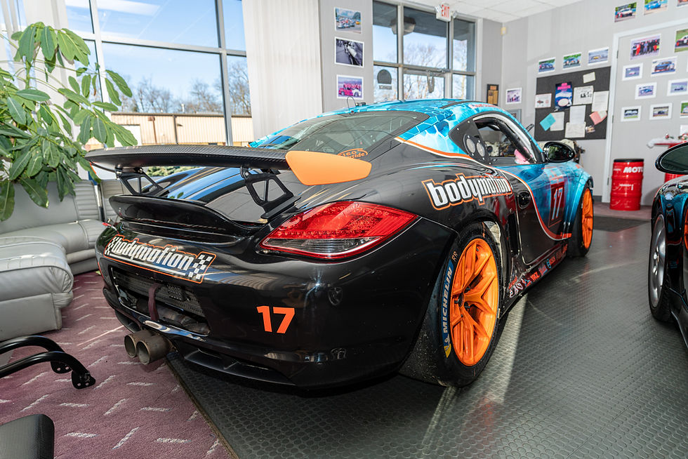 Thumbnail: rear view of blue 2012 Cayman S Race Car 