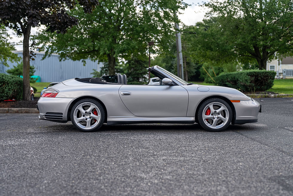 Thumbnail: side profile of silver 2004 Porsche C4s Cabrio 6 Speed