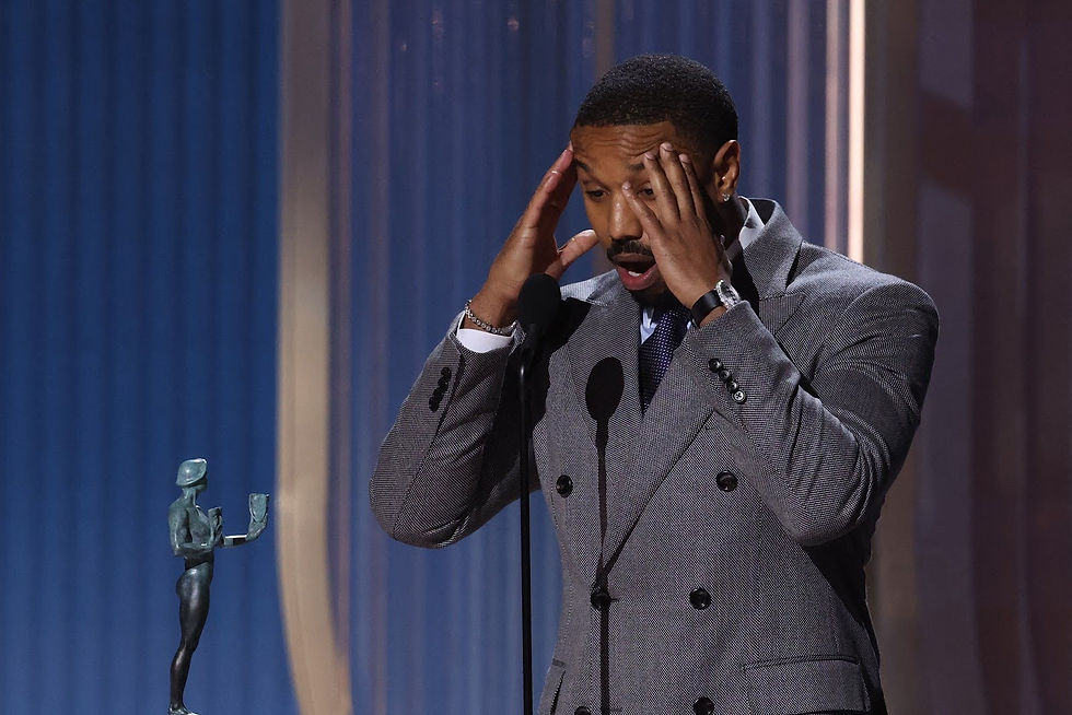 A shocked Michael B. Jordan receives his Actor Award for Outstanding Performance by a Male Actor in a Lead Role. Source: Actor Awards
