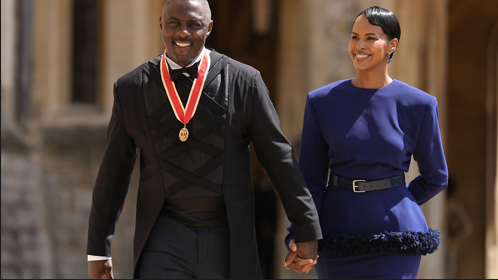 Activist, Actor and Musician Sir Idris Elba, left, walks with wife Sabrina Dhowre Elba, after being made a Knight Bachelor by King Charles III at Windsor Castle, England, June 2, 2026.(Andrew Matthews/PA via AP, Pool)
