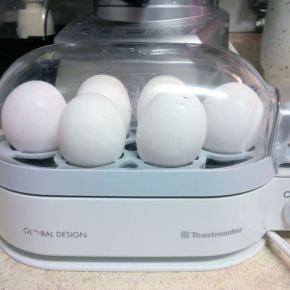 6-egg cooker with eggs cooking in shells