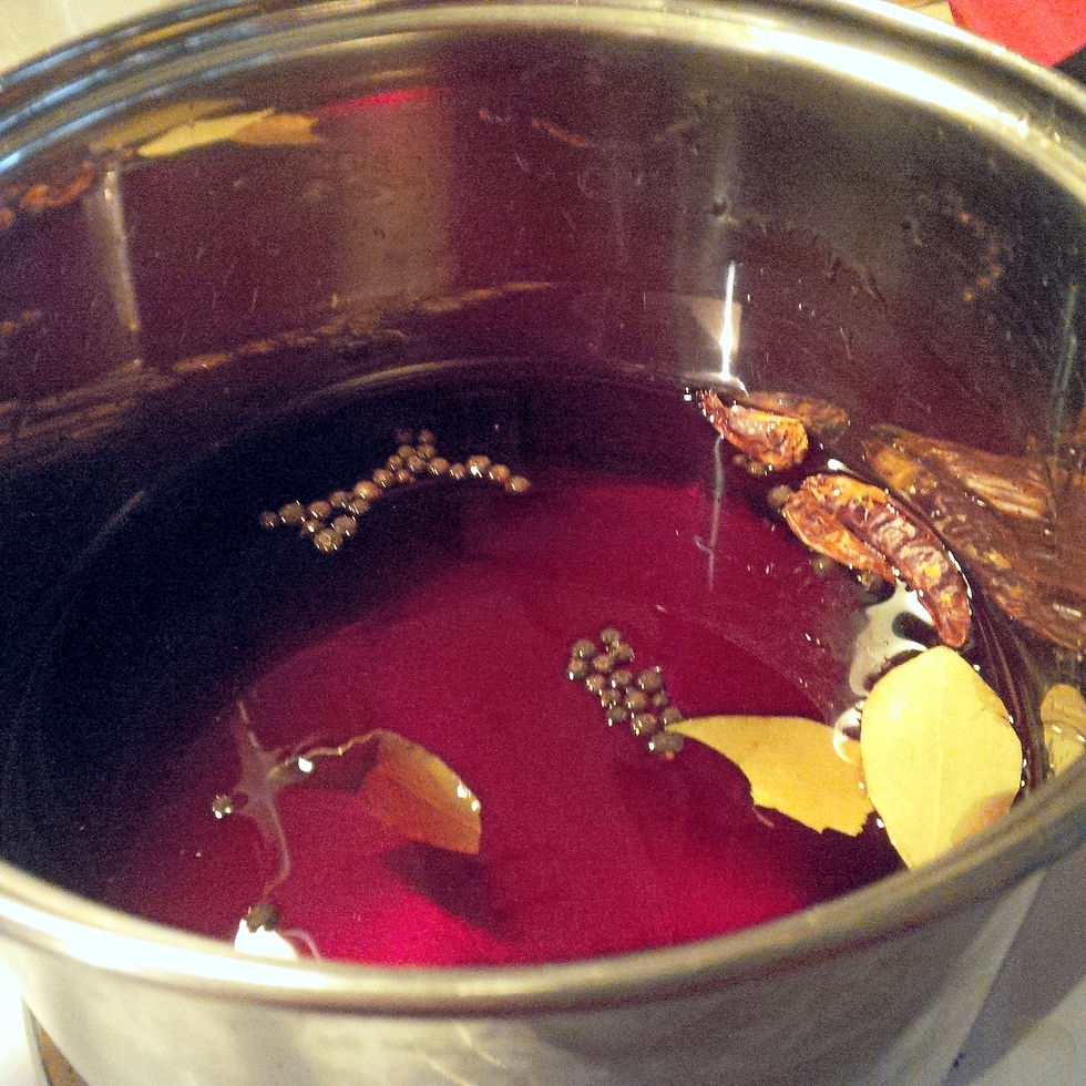 The pickling liquid cooking, with leftover beet juice from a can and seasonings