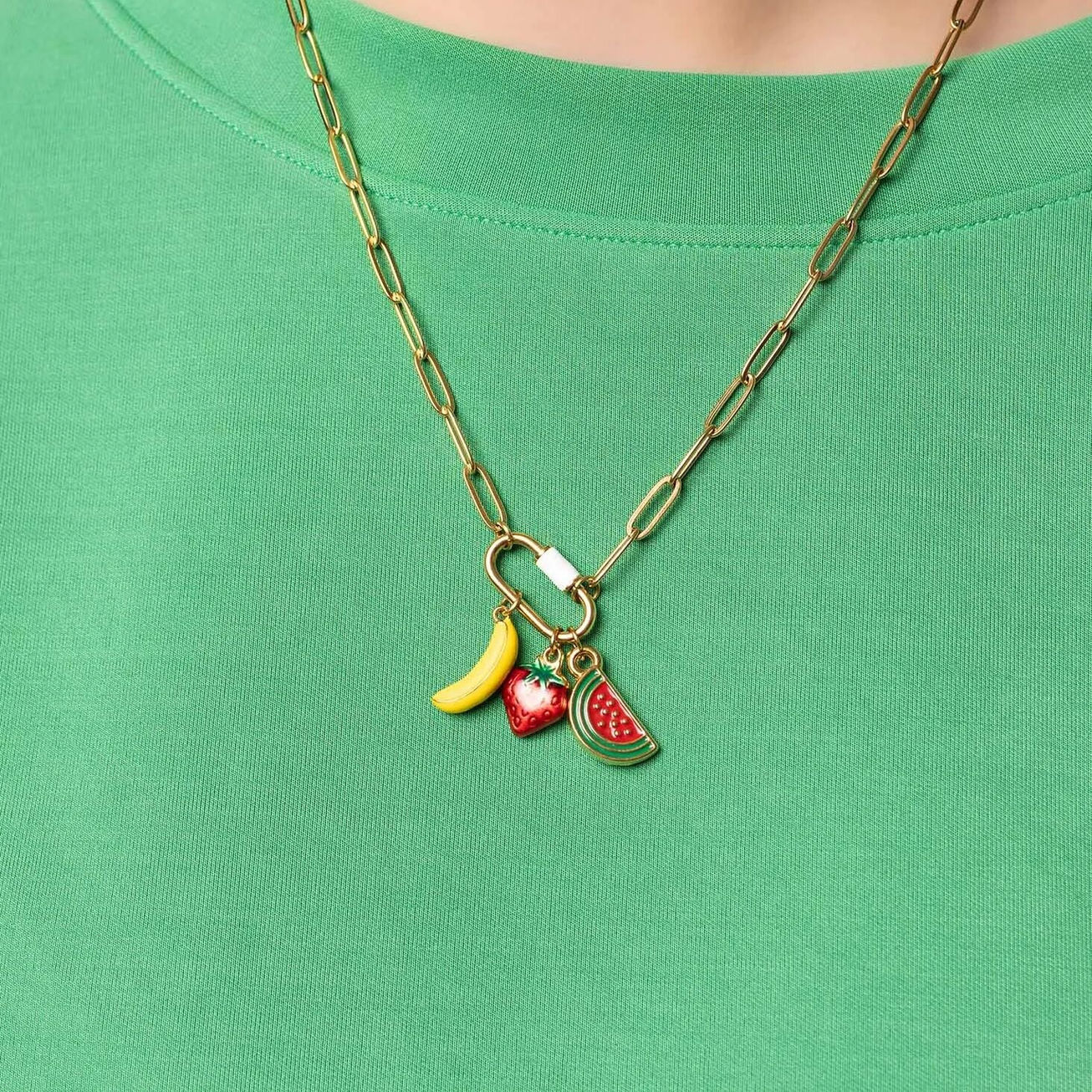 Enamel Carabiner Paperclip Necklace shown in 18K Gold PVD Plated Stainless Steel on model showcasing our Enamel Fruit Charms