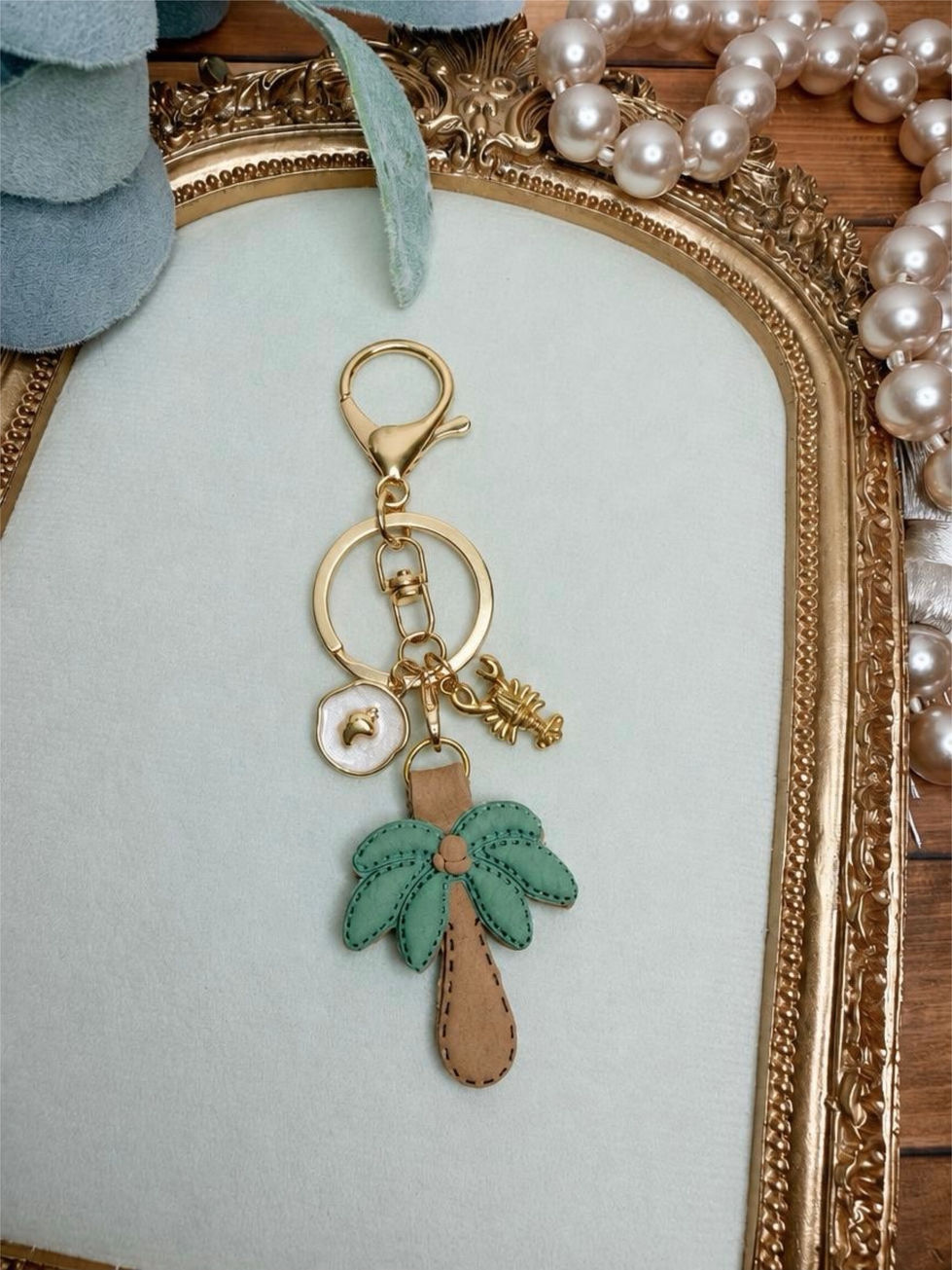 Handmade Palm Springs clay key ring with green palm tree, gold-tone hardware, and coordinating tropical accent charms.