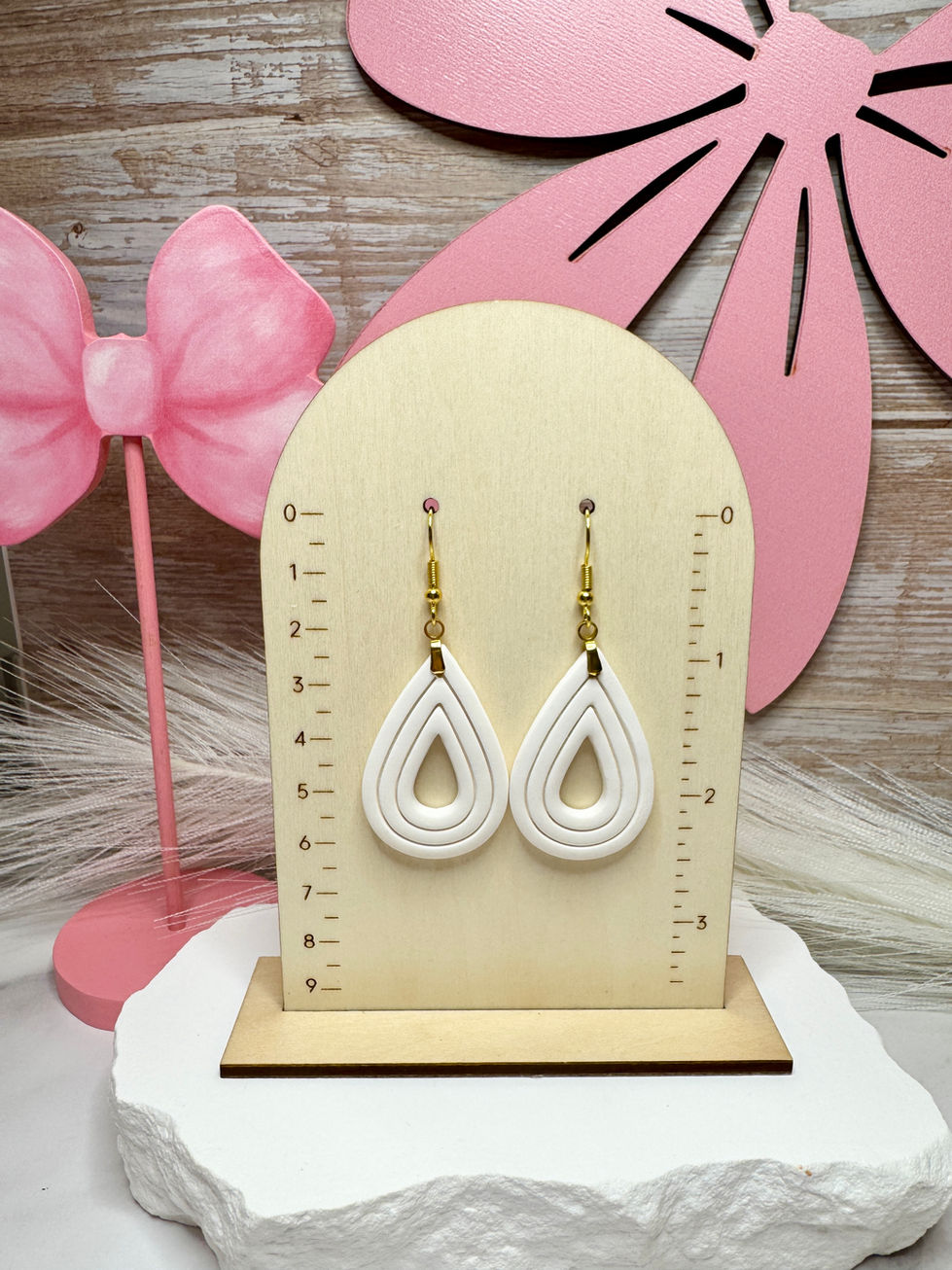 Elizabeth | Sculpted Polymer Clay Earrings displayed on size chart.