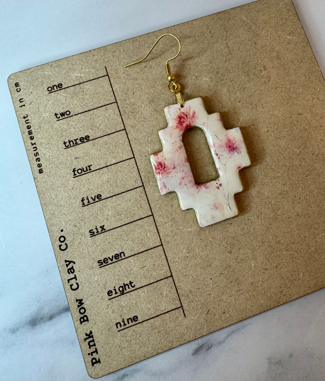 Canyon Rose earrings shown on ruler board 7 cm height