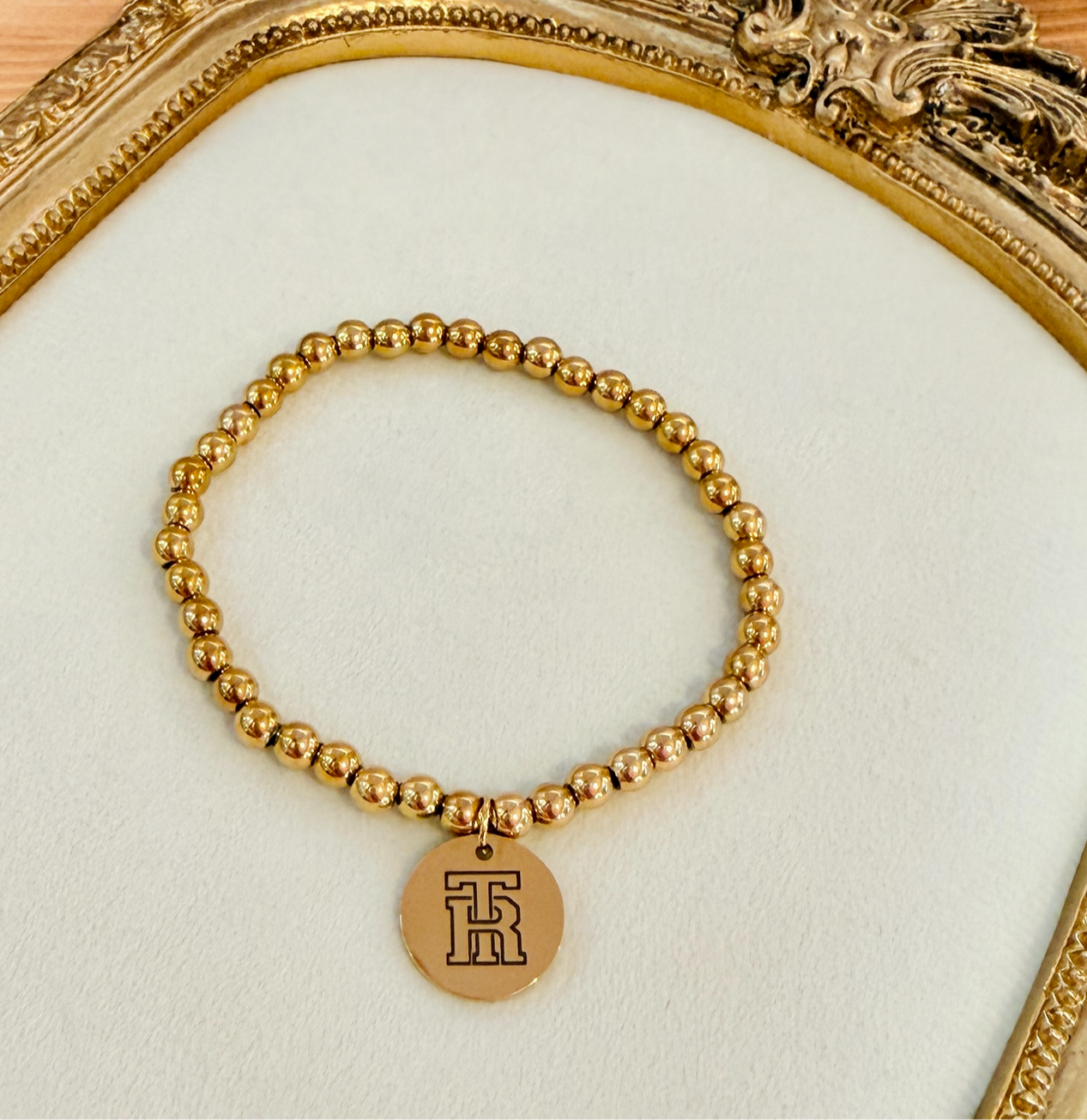 TR Medallion Beaded Stretch Bracelet shown in 18K Gold PVD Plated SS