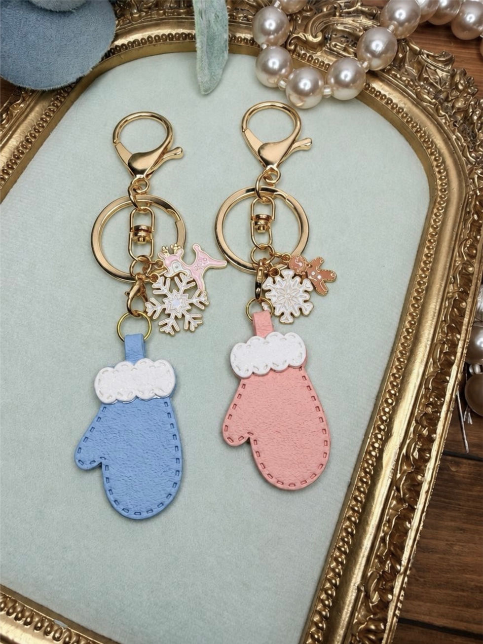 Handmade polymer clay Cozy Mittens key ring - bag charm with gold hardware and charms.