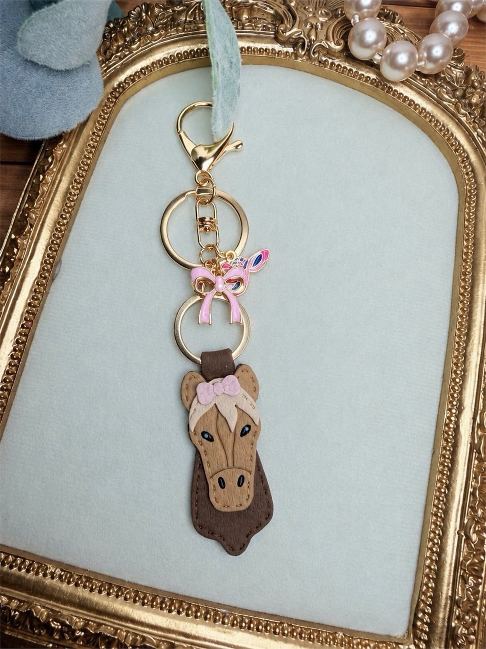 Handmade Pretty Pony clay key ring with brown horse, pink bow, gold-tone hardware, and coordinating equestrian accent charms.