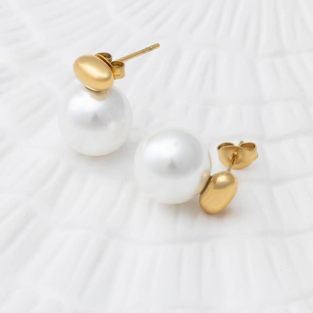 Close up of the Glass Pearl Stud Earrings shown in 18K PVD Plated SS