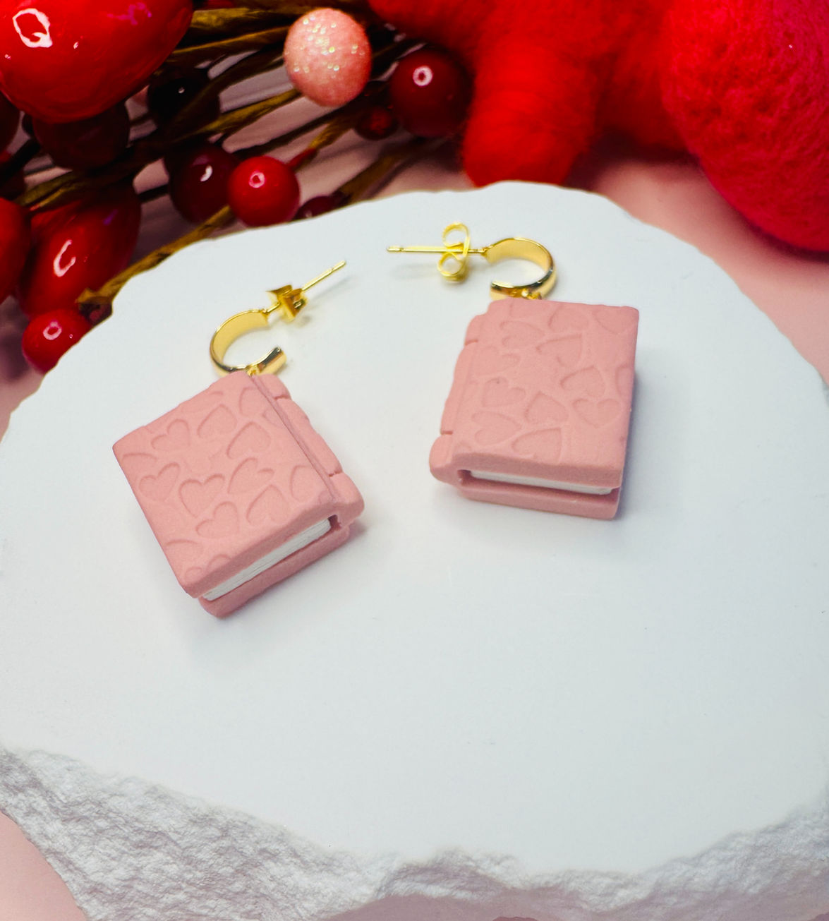 Pink Book of Love earrings with heart pattern