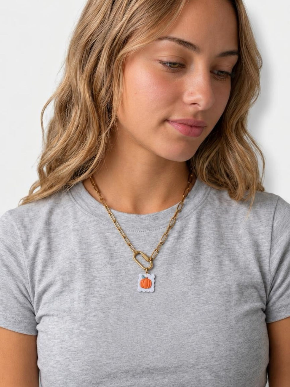 Model wearing Pumpkin Patch - Polymer Clay Charm styled on 18K Gold PVD Plated Carabiner Necklace