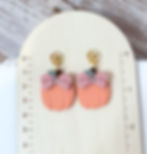 Pumpkin Bow Bloom | Polymer Clay Earrings with gold plated flower stud shown on ruler board