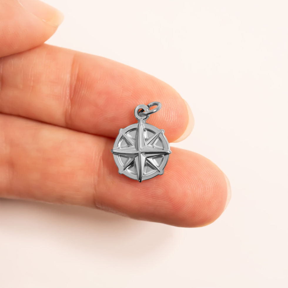 Compass Charm shown in Polished 316L Surgical Stainless Steel on fingers for size comparison
