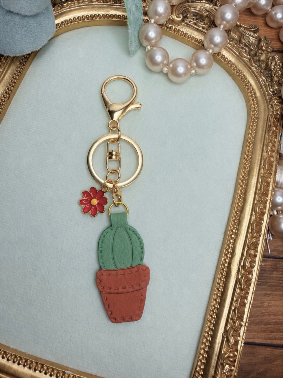 Handmade Desert Bloom clay key ring with sage cactus, terracotta pot, gold-tone hardware, and colorful accent charms.