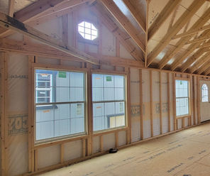 Interior view of a Side Utility with sunburst dormers.