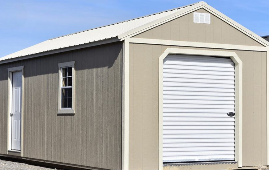 12x28 Derksen Portable Garage Storage Shed customized with 6' roll up door for home storage.