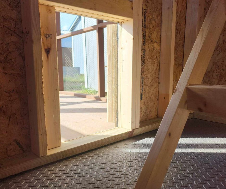 Thumbnail: View leading from inside the chicken coop to the outdoor secure run area.