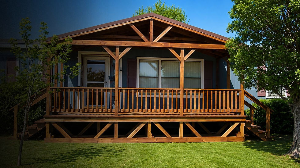 Gable roof portable deck and porch built for a manufactured home with wood railings, steps, and covered outdoor living space