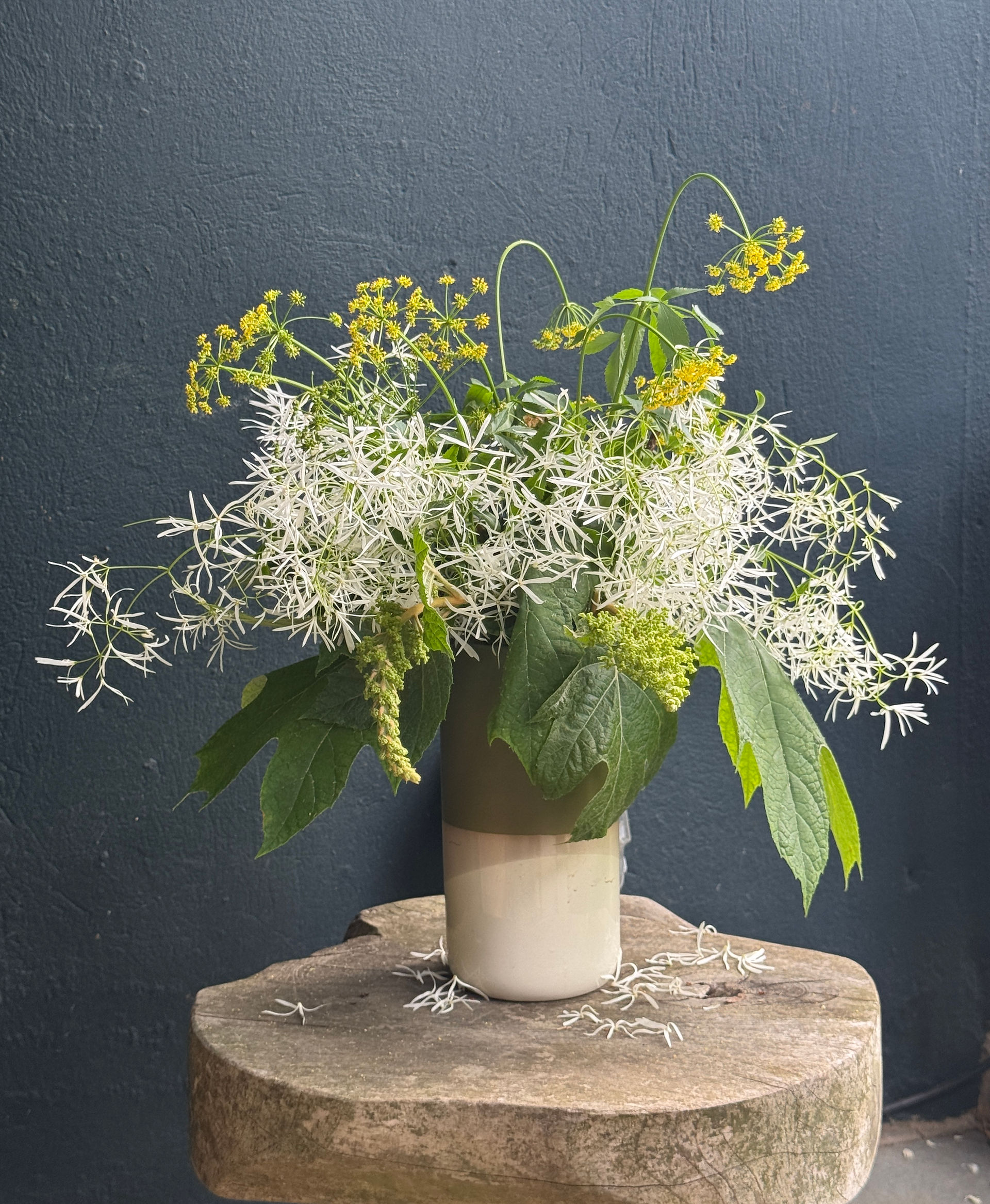 flower arrangement blue wall