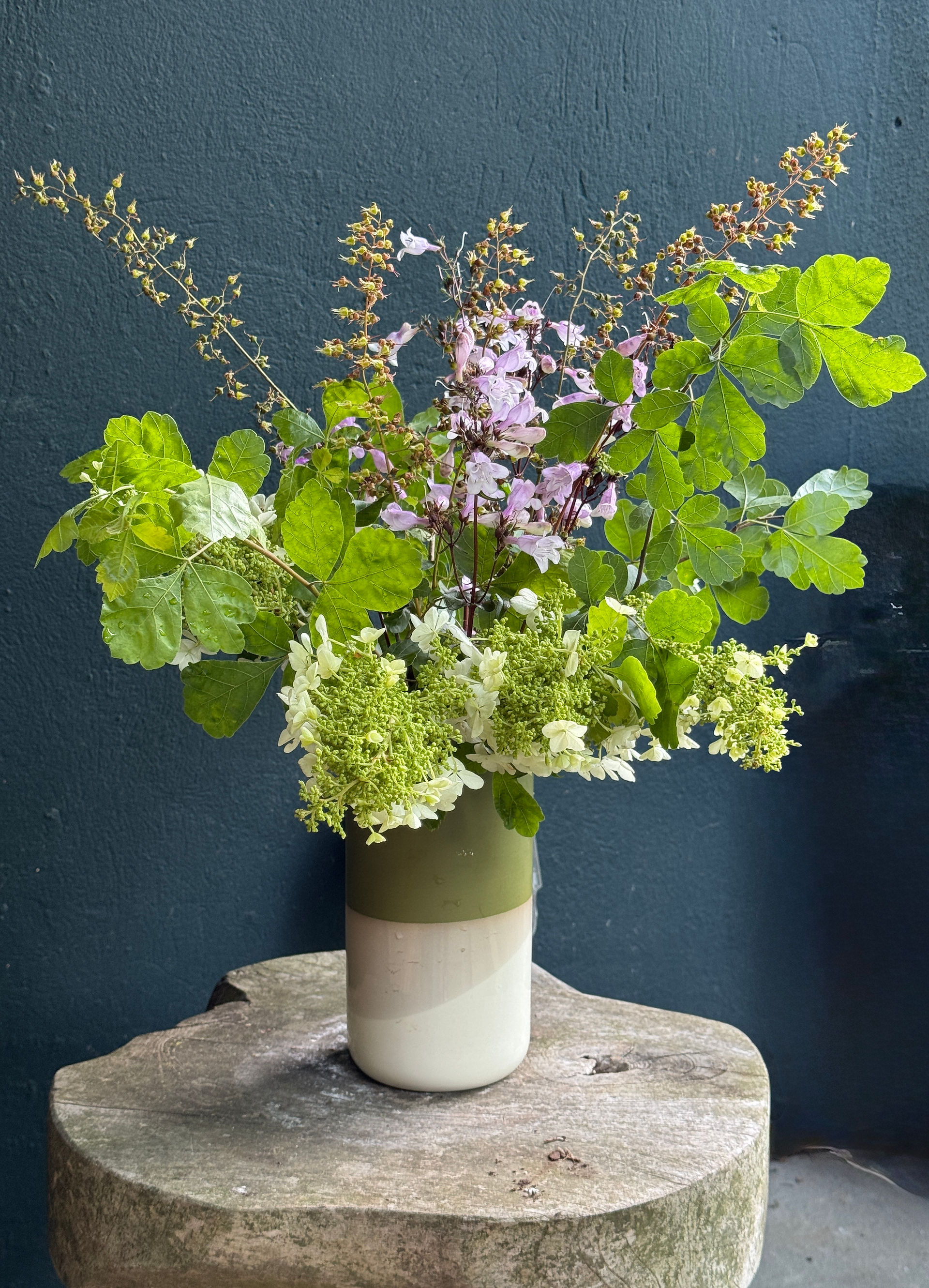 flower arrangement blue wall