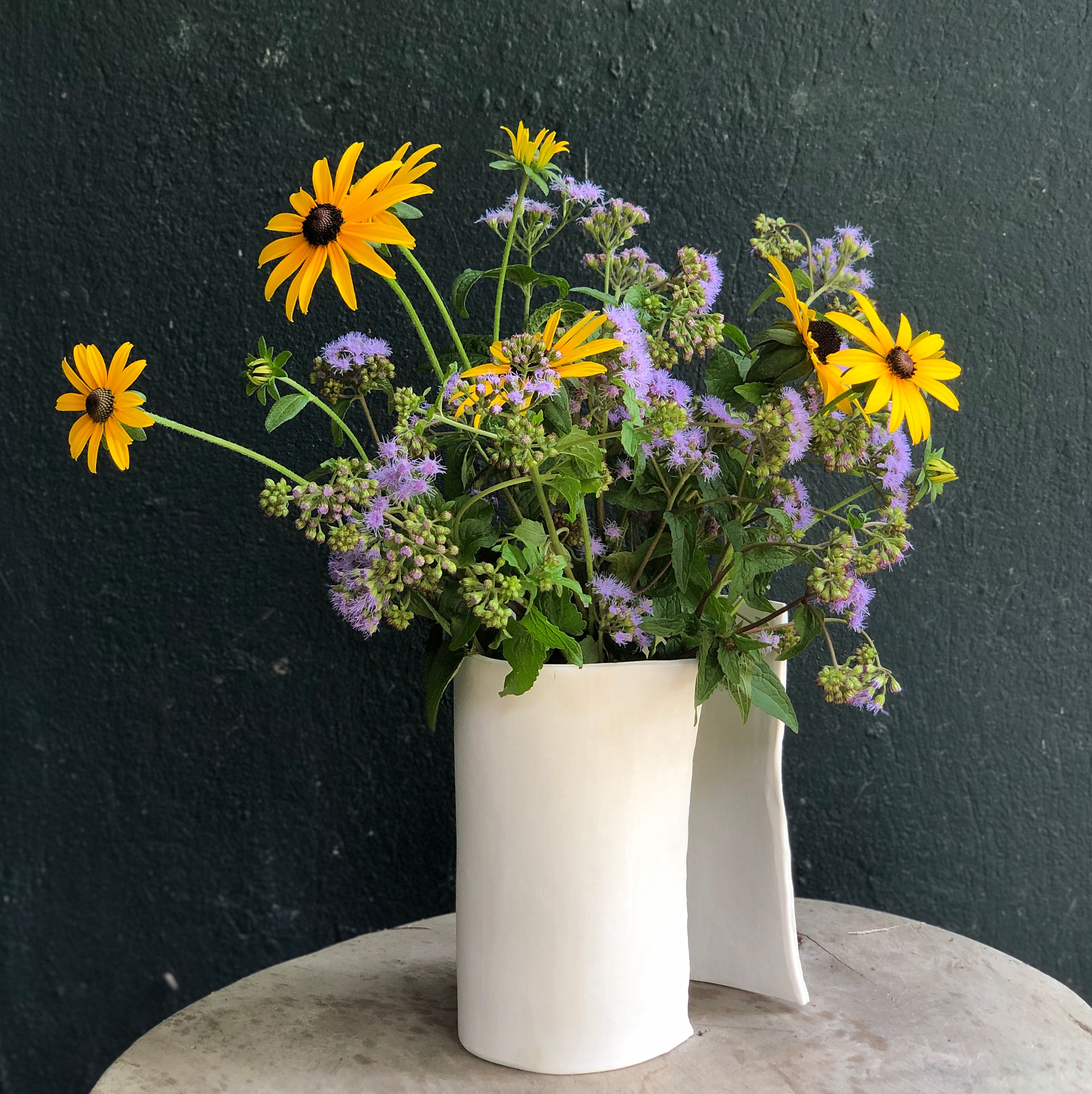 vase with yellow and lavender flowers