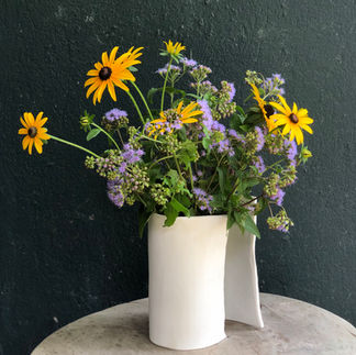vase with yellow and lavender flowers