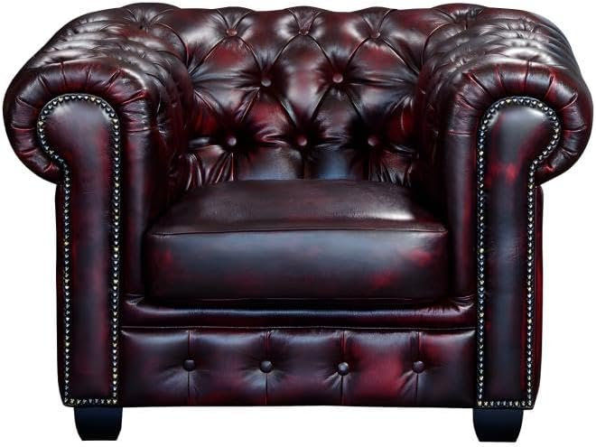 Fauteuil Chesterfield cuir bordeaux capitonné
