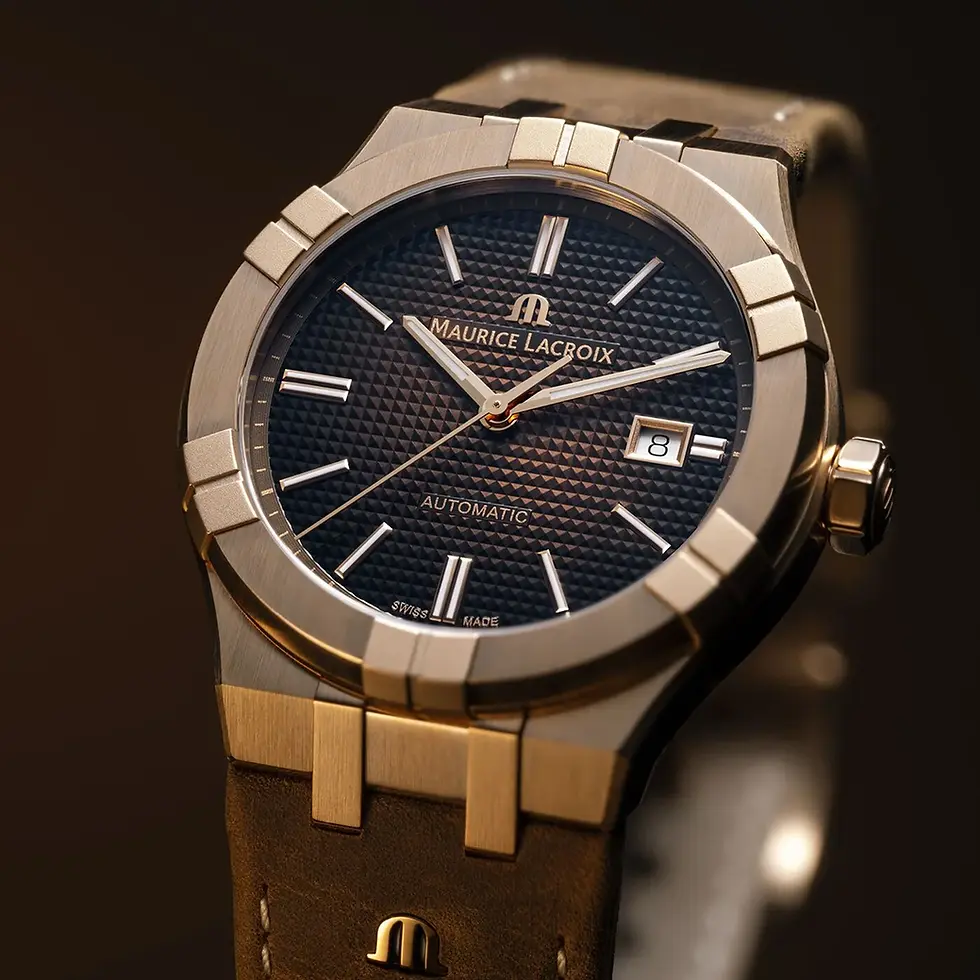 Montre automatique Maurice Lacroix en bronze avec cadran texturé noir, index et aiguilles en acier poli, affichage de la date et bracelet cuir haut de gamme.