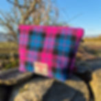 Handmade Harris Tweed® pouch in pink and purple check, crafted in Scotland with cotton lining and YKK zip