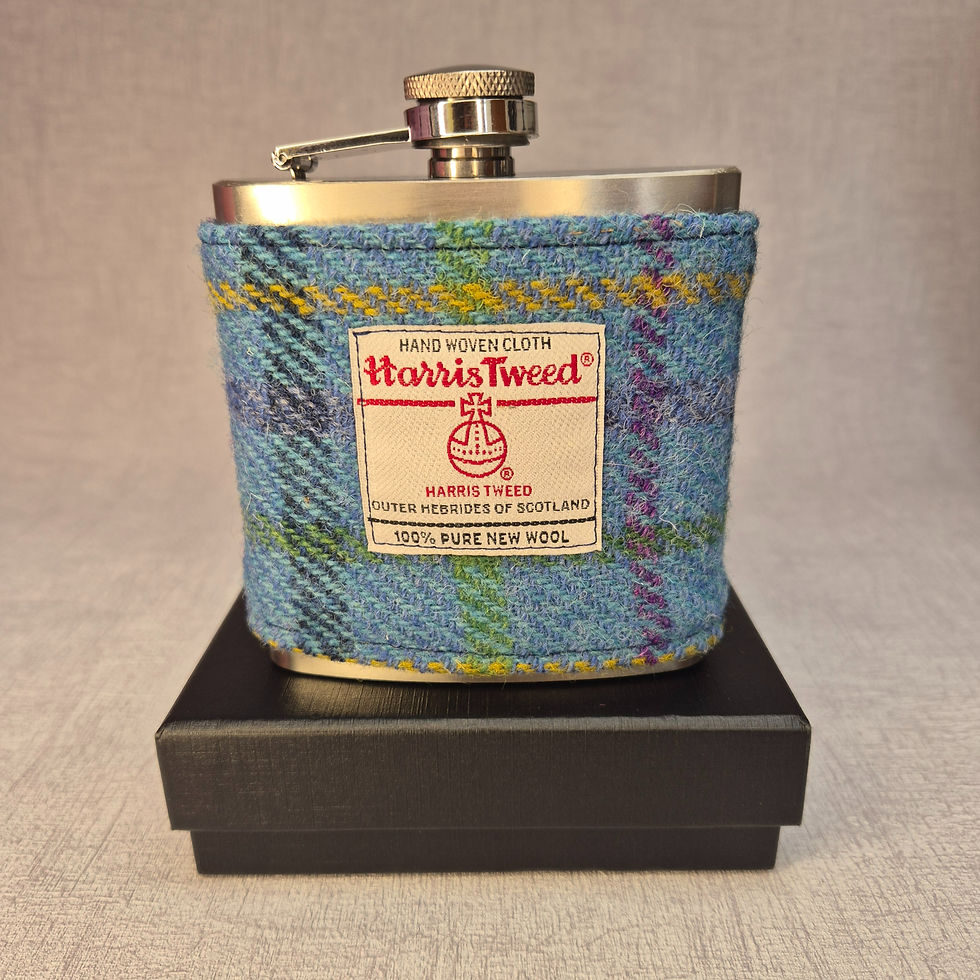 Handmade 6oz stainless steel hip flask with Harris Tweed® No. A0154 sleeve, presented in silk-lined gift box.
