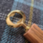 Gold bottle opener made from reclaimed whisky barrel wood
