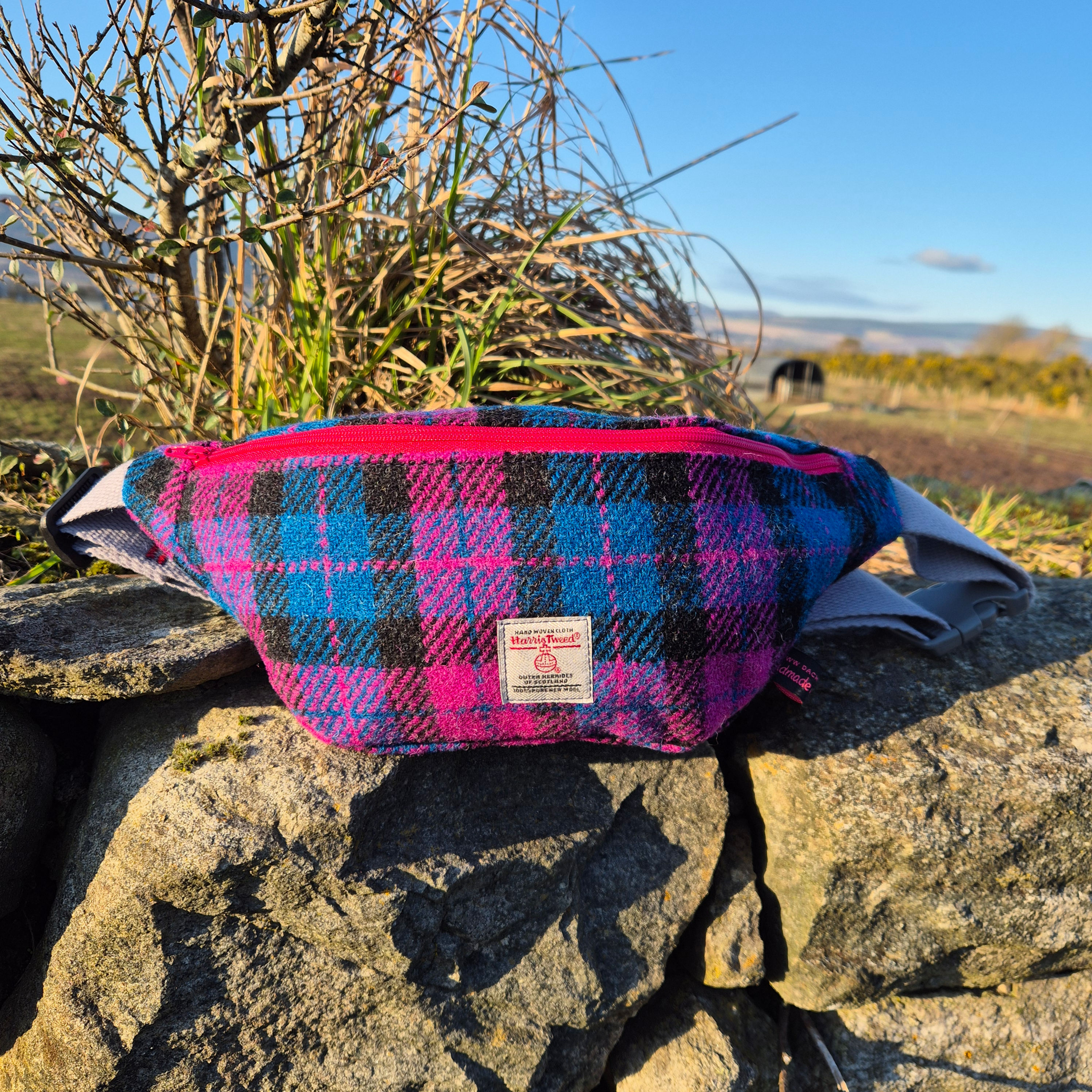Handmade Harris Tweed® bum bag in pink & purple check with cotton sheep-pattern lining