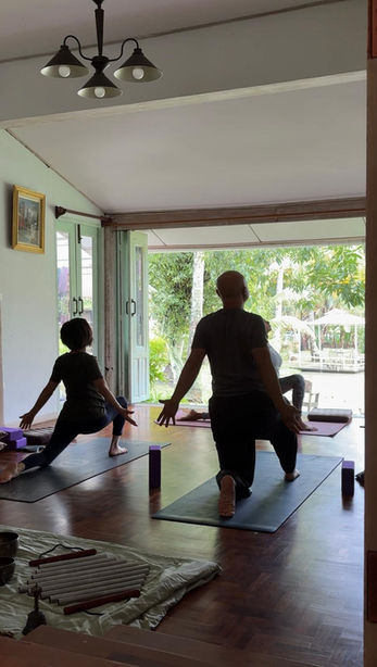 silhouette of a couple doing yoga