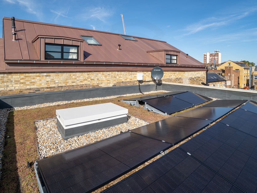 Addition of four new flats to an occupied residential building in Dalston, completed with full fire safety compliance and building control approval.