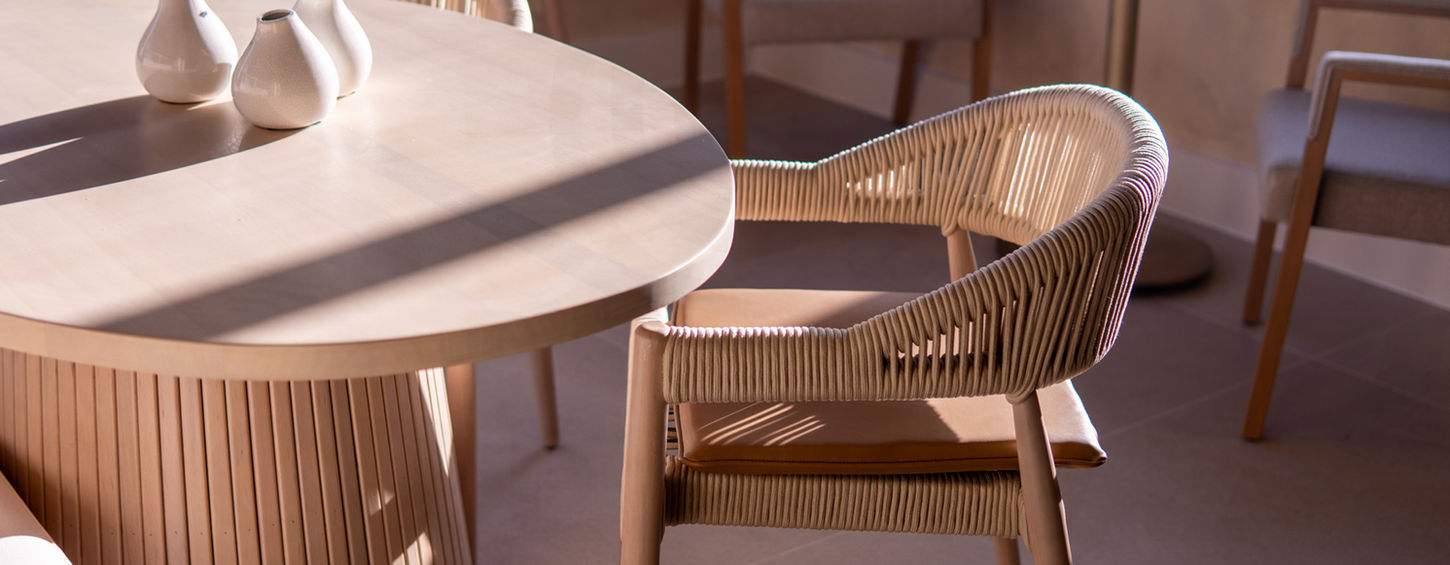 Dining space with timber furniture and warm lighting at Amelia’s North Acton