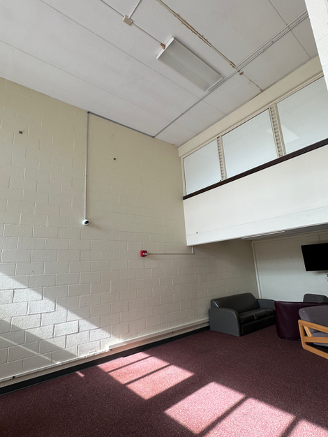 Indoor security camera installed in a college campus common area